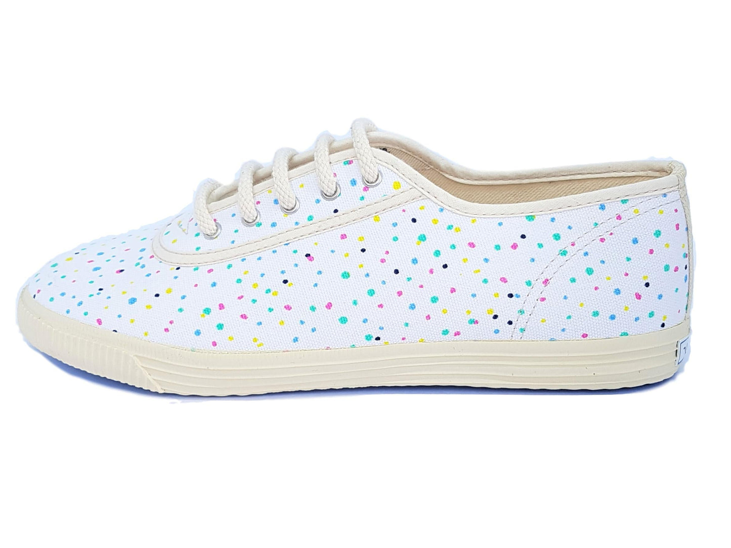 White sneaker with colorful polka dots on a white background
